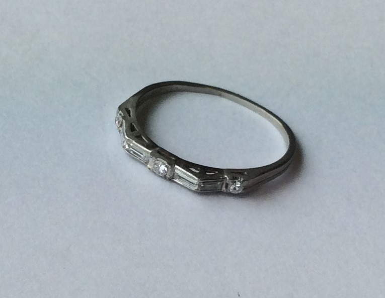 An unusual platinum and diamond half eternity ring - Image 2 of 2