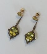 A good pair of large diamond mounted drop earrings