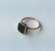 A gent's 9 carat bloodstone set signet ring. Appro