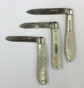 A group of four silver and MOP fruit knives decora