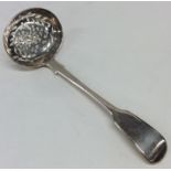 A heavy silver fiddle pattern sifter spoon. London