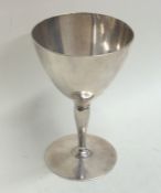 TIFFANY & CO: A tapering silver goblet on circular