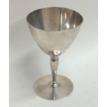 TIFFANY & CO: A tapering silver goblet on circular