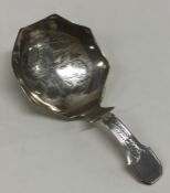 A good large Georgian silver bright cut caddy spoo