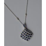An attractive sapphire and diamond drop pendant wi