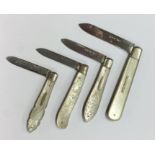 A group of four silver and MOP fruit knives decora