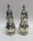A good pair of Edwardian silver sugar casters with