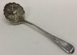 A Georgian silver chased ladle decorated with flow