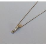 A heavy 18 carat diamond two row pendant with loop