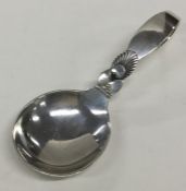 GEORG JENSEN: An unusual silver caddy spoon of typ