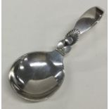 GEORG JENSEN: An unusual silver caddy spoon of typ