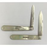 Two large silver and MOP fruit knives with vacant