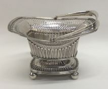 A Georgian silver swing handled sweet dish with fl