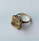 A 14 carat citrine single stone ring. Approx. 7.9