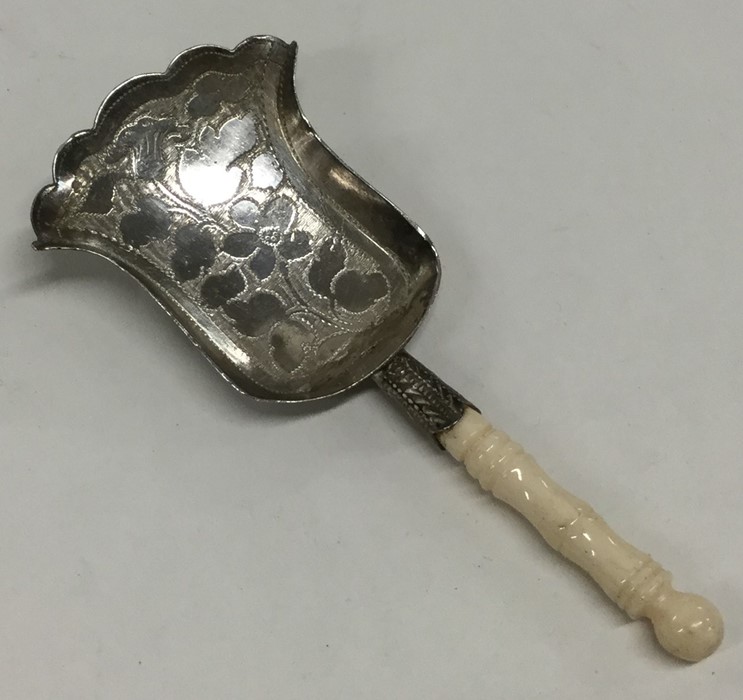A Georgian silver bright cut caddy shovel decorate