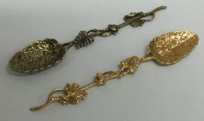 A pair of Antique silver gilt spoons decorated wit