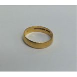 A 22 carat gold plain wedding band. Approx. 3.2 gr