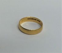 A 22 carat gold plain wedding band. Approx. 3.2 gr