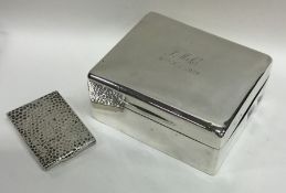 A heavy silver textured match case together with a