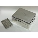 A heavy silver textured match case together with a