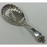 An Edwardian silver caddy spoon with fluted bowl a