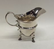 A small Georgian style silver cream jug. London. B