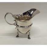 A small Georgian style silver cream jug. London. B