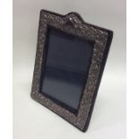 A modern silver embossed picture frame. Est. £30 -