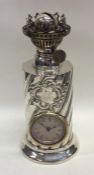 An unusual silver lamp mounted with a clock with s