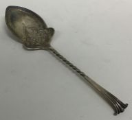 An Edwardian silver preserve spoon with twisted st