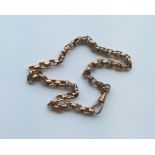A 9 carat rose gold fancy link chain. Approx. 23.6