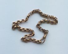 A 9 carat rose gold fancy link chain. Approx. 23.6
