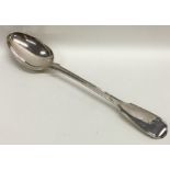 A fiddle and thread pattern silver basting spoon.