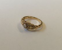 An attractive 14 carat gold diamond cluster ring w