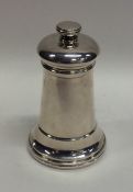 An unusual silver plated tapering pepper grinder.