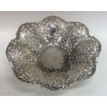 A heavy embossed silver sweet dish decorated with