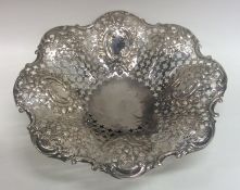 A heavy embossed silver sweet dish decorated with