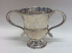 A Georgian silver two handled tapering cup on pede