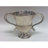 A Georgian silver two handled tapering cup on pede