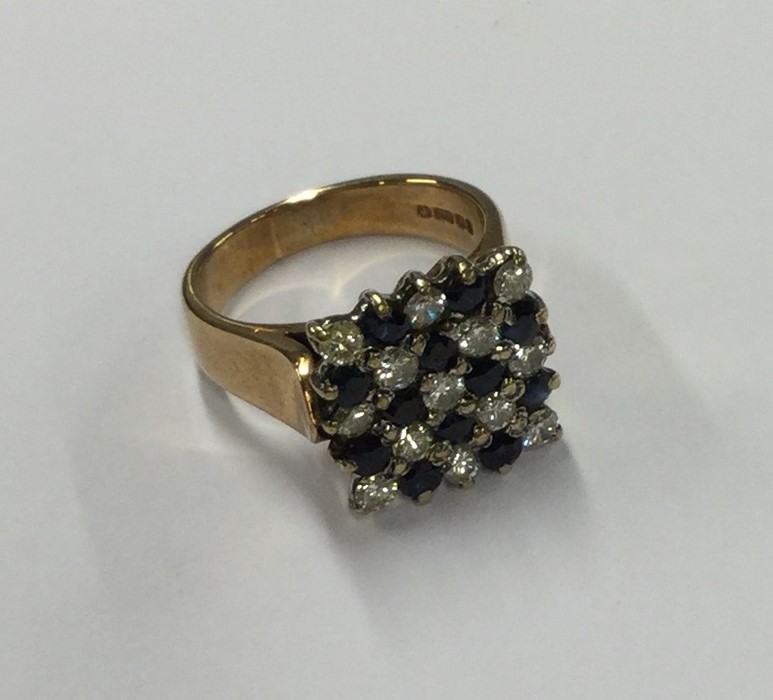 A large sapphire and diamond chequerboard ring in