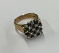 A large sapphire and diamond chequerboard ring in