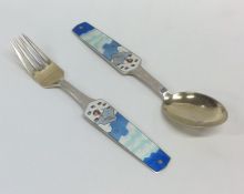 A silver and enamelled spoon and fork decorated wi