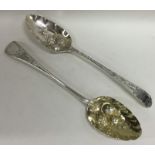 Two Georgian silver embossed berry spoons. Approx.