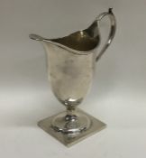 A Georgian silver Adams' style cream jug on square