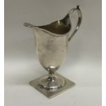 A Georgian silver Adams' style cream jug on square