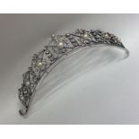 A stylish silver and paste tiara with pierced deco