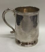 NEWCASTLE: A Georgian silver tapering mug on pedes