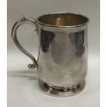 NEWCASTLE: A Georgian silver tapering mug on pedes