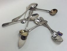 A bag containing silver and other cruet spoons, te