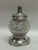An unusual silver mounted glass sugar caster with